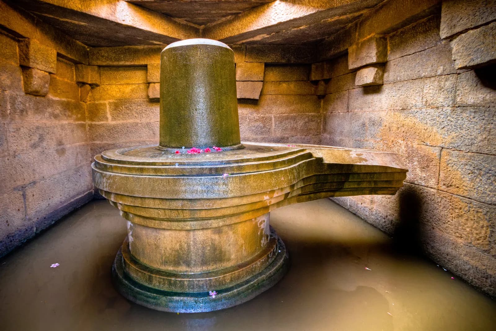 A large stone Shiva lingam in a sanctum at Hampi